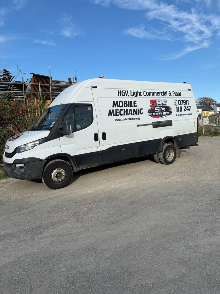White HGV light commercial van labeled Mobile Mechanic parked on street with clear blue sky background
